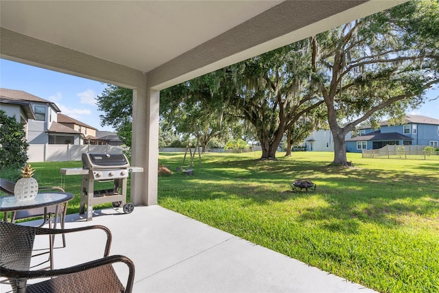 4690 Coachford Dr, Wesley Chapel, FL 33543 - view of patio / terrace featuring grilling area and a residential view
