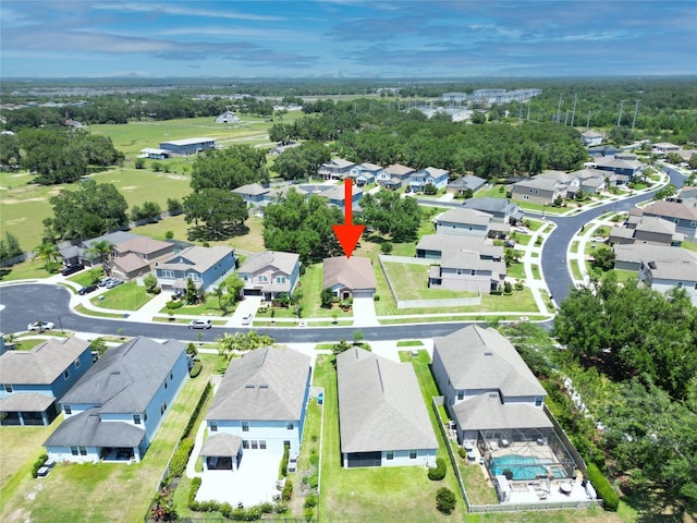4690 Coachford Dr, Wesley Chapel, FL 33543 - aerial view of property and surrounding area featuring nearby suburban area and a tree filled landscape