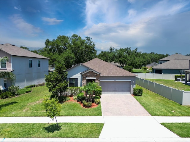 4690 Coachford Dr, Wesley Chapel, FL 33543 - ranch-style house featuring decorative driveway, an attached garage, stone siding, stucco siding, and a residential view