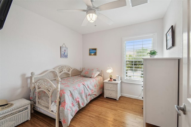 3227 Rose Arbor Dr, Hernando Beach, FL 34607 - bedroom with light wood-style flooring, baseboards, and a ceiling fan