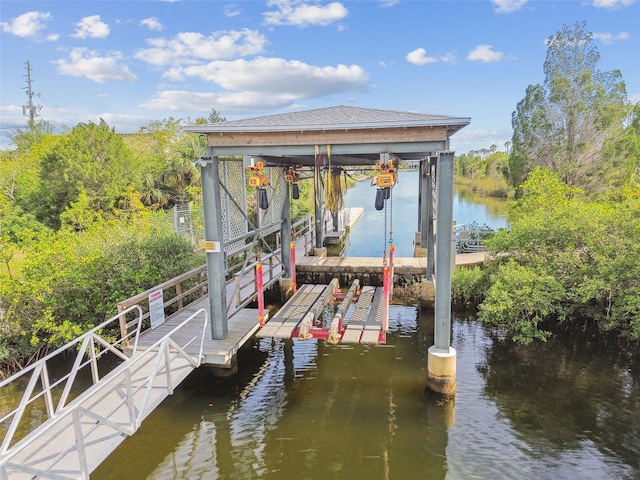3227 Rose Arbor Dr, Hernando Beach, FL 34607 - dock area with boat lift and a water view