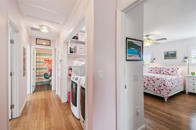 3227 Rose Arbor Dr, Hernando Beach, FL 34607 - laundry room featuring light wood-type flooring, washing machine and clothes dryer, and ceiling fan