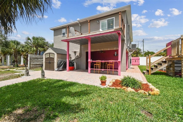 3227 Rose Arbor Dr, Hernando Beach, FL 34607 - view of front of house with stairway, central air condition unit, a patio, and a balcony