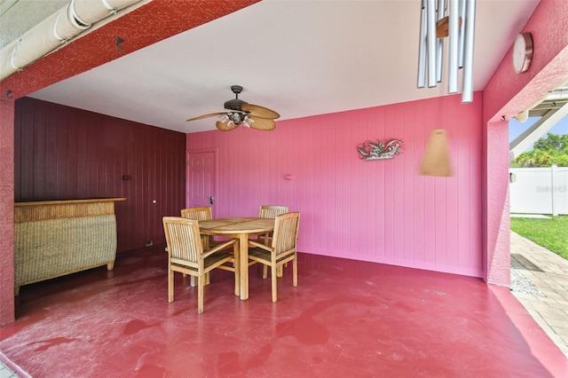 3227 Rose Arbor Dr, Hernando Beach, FL 34607 - dining room with a ceiling fan and wooden walls