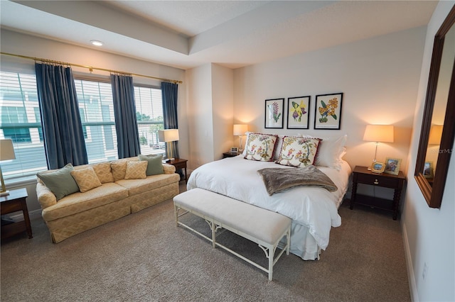 bedroom featuring carpet flooring and baseboards