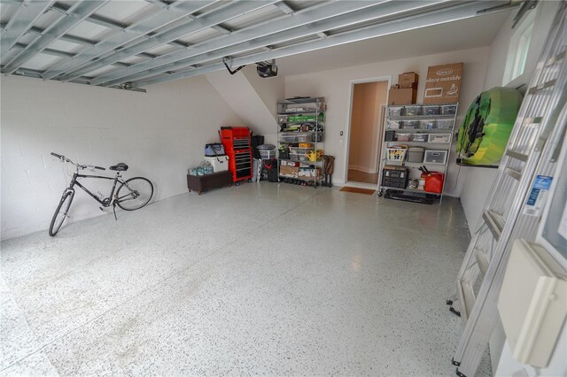 garage with concrete block wall