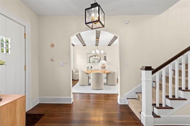 455 18th Ave NE, Saint Petersburg, FL 33704 - foyer entrance featuring arched walkways, wood finished floors, stairs, and a chandelier