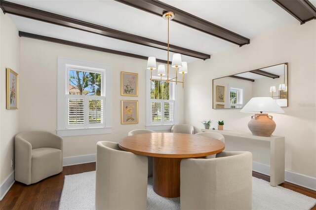 455 18th Ave NE, Saint Petersburg, FL 33704 - dining area featuring baseboards, a chandelier, wood finished floors, and beam ceiling