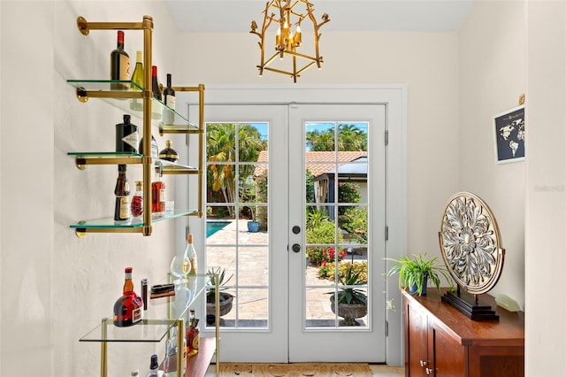 455 18th Ave NE, Saint Petersburg, FL 33704 - entryway with french doors and a chandelier