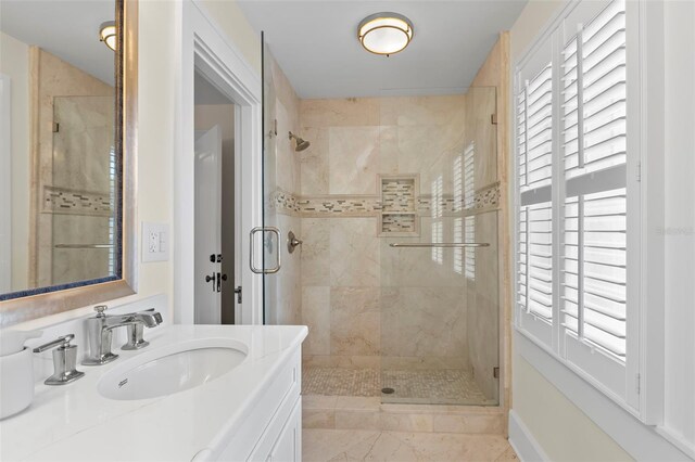 455 18th Ave NE, Saint Petersburg, FL 33704 - bathroom with a shower stall, plenty of natural light, and vanity
