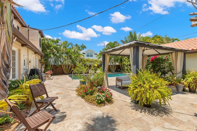 455 18th Ave NE, Saint Petersburg, FL 33704 - view of patio featuring a gazebo and a fenced backyard