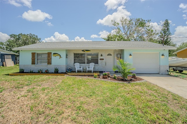 ranch-style house with brick siding, an attached garage, concrete driveway, and a front yard