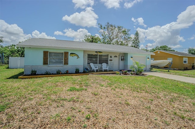 ranch-style home featuring brick siding, an attached garage, covered porch, and driveway