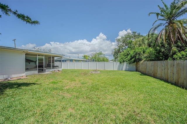 view of yard with a sunroom