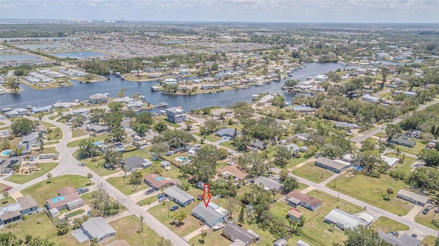 view of property location featuring a large body of water and nearby suburban area