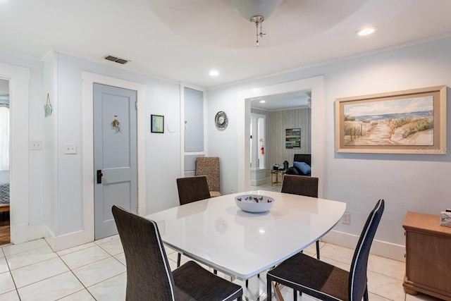 945 8th St N, Saint Petersburg, FL 33712 - dining room with light tile patterned floors, baseboards, and recessed lighting