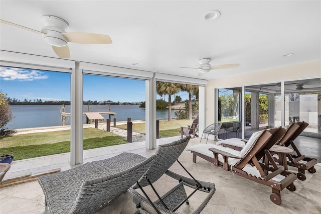 321 N Blvd Of The Presidents, Sarasota, FL 34236 - sunroom with ceiling fan and a water view