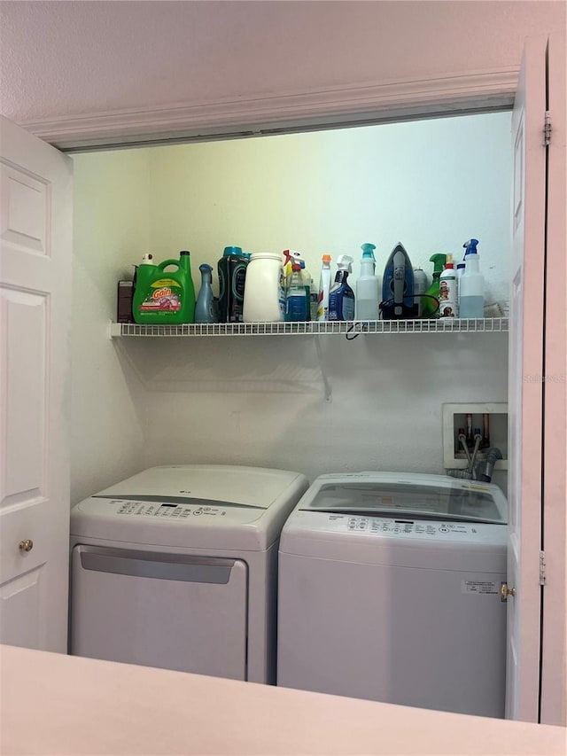 laundry area with washing machine and dryer
