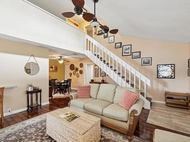 5729 Calais Blvd N Unit 6, Saint Petersburg, FL 33714 - living room with ceiling fan, stairs, baseboards, lofted ceiling, and wood finished floors