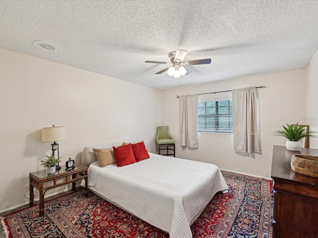 5729 Calais Blvd N Unit 6, Saint Petersburg, FL 33714 - bedroom featuring baseboards, a textured ceiling, and ceiling fan