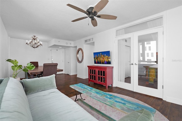 living area featuring french doors, a chandelier, wood finished floors, baseboards, and a textured ceiling