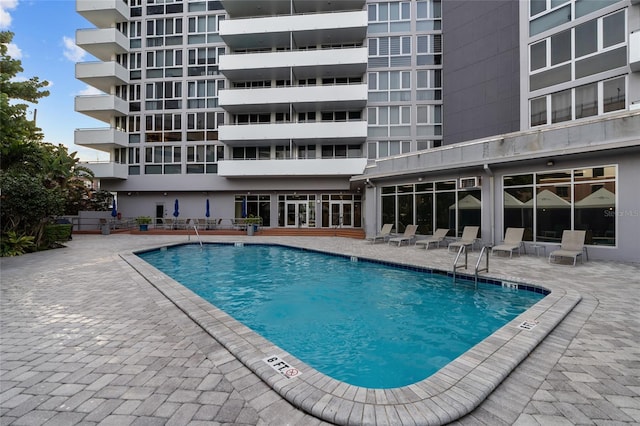 community pool featuring a patio area