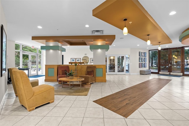 common area with a wall of windows and recessed lighting
