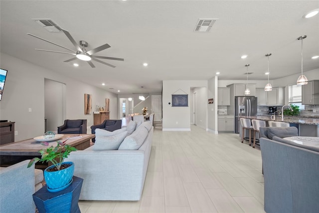 31643 Colada Drift Way, Wesley Chapel, FL 33545 - living area with ceiling fan, recessed lighting, and baseboards
