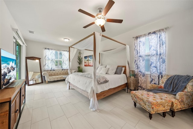 31643 Colada Drift Way, Wesley Chapel, FL 33545 - bedroom featuring multiple windows and a ceiling fan