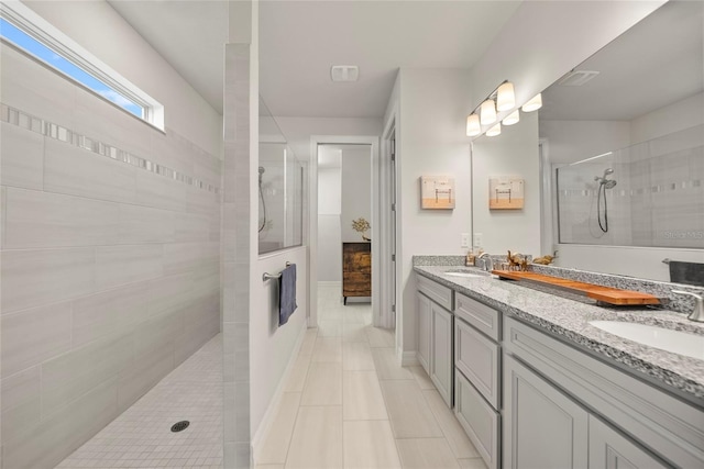 31643 Colada Drift Way, Wesley Chapel, FL 33545 - bathroom with walk in shower, double vanity, and tile patterned floors