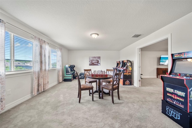 31643 Colada Drift Way, Wesley Chapel, FL 33545 - carpeted dining space with a textured ceiling and baseboards