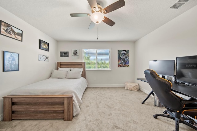31643 Colada Drift Way, Wesley Chapel, FL 33545 - carpeted bedroom featuring a desk, baseboards, ceiling fan, and a textured ceiling