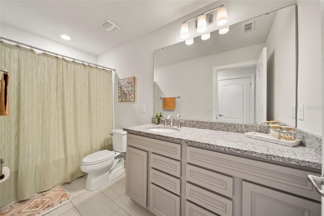 31643 Colada Drift Way, Wesley Chapel, FL 33545 - bathroom featuring toilet, double vanity, and tile patterned flooring