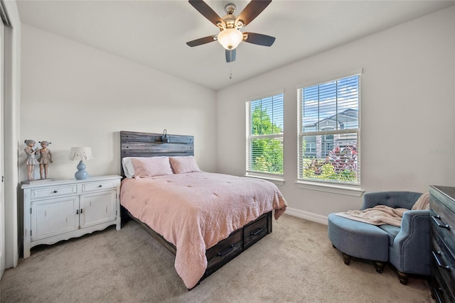 31643 Colada Drift Way, Wesley Chapel, FL 33545 - bedroom featuring light colored carpet, baseboards, and ceiling fan