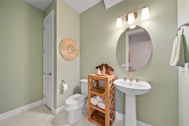 31643 Colada Drift Way, Wesley Chapel, FL 33545 - half bathroom featuring toilet, baseboards, and tile patterned floors
