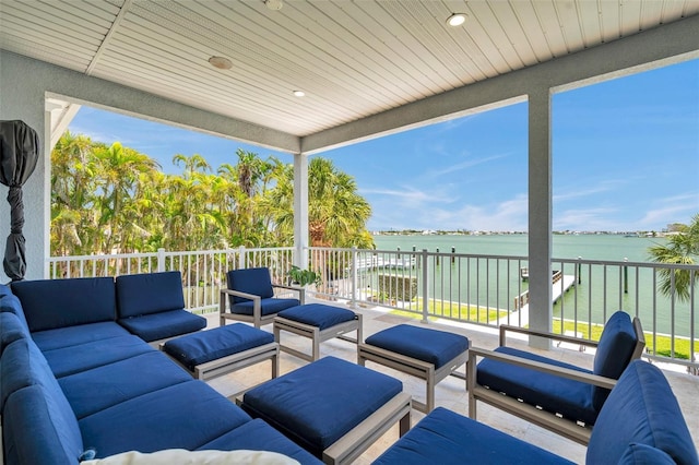7115 Bay St, St Pete Beach, FL 33706 - view of patio featuring an outdoor hangout area and a water view