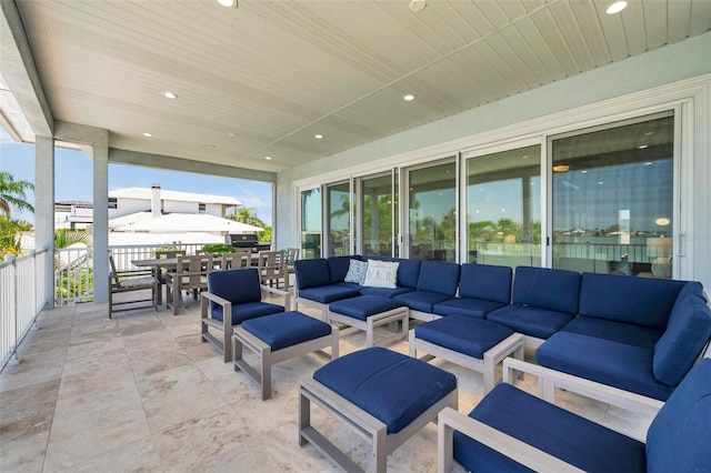7115 Bay St, St Pete Beach, FL 33706 - view of patio / terrace featuring outdoor lounge area and outdoor dining space