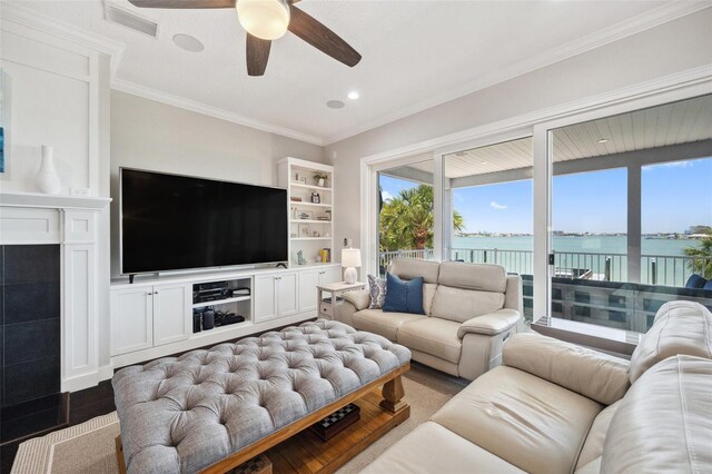 7115 Bay St, St Pete Beach, FL 33706 - living area featuring a ceiling fan, ornamental molding, wood finished floors, and recessed lighting
