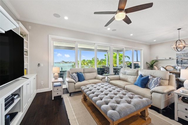 7115 Bay St, St Pete Beach, FL 33706 - living area with a ceiling fan, dark wood finished floors, a chandelier, crown molding, and recessed lighting