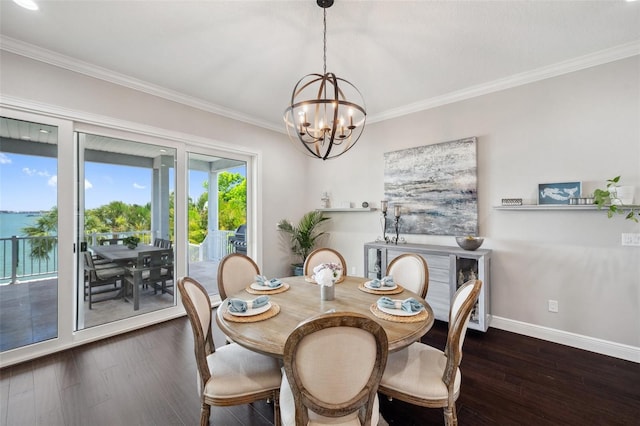 7115 Bay St, St Pete Beach, FL 33706 - dining area with dark wood-style floors, a chandelier, ornamental molding, and baseboards