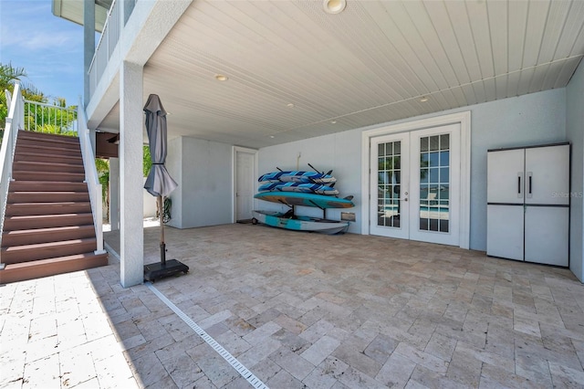 7115 Bay St, St Pete Beach, FL 33706 - view of patio with stairway and french doors