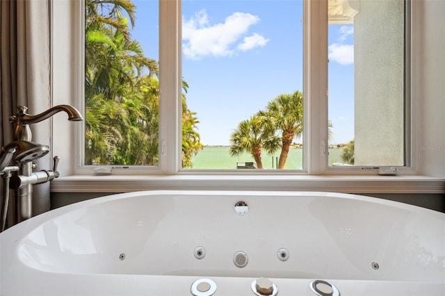 7115 Bay St, St Pete Beach, FL 33706 - full bath with a whirlpool tub and plenty of natural light