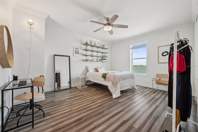 7115 Bay St, St Pete Beach, FL 33706 - bedroom featuring wood finished floors, crown molding, baseboards, and ceiling fan