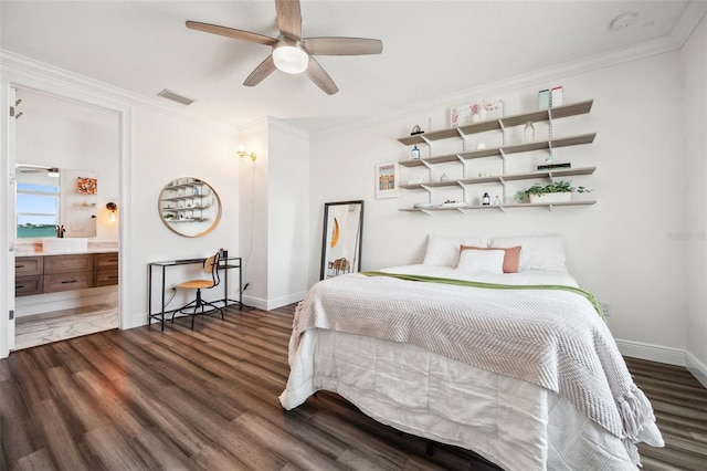 7115 Bay St, St Pete Beach, FL 33706 - bedroom featuring ornamental molding, dark wood-style flooring, baseboards, and ensuite bathroom