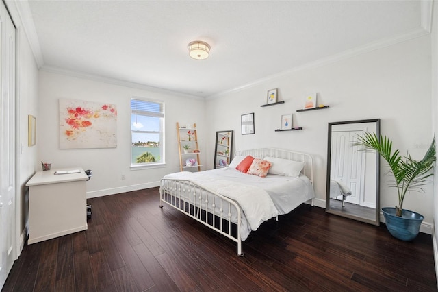 7115 Bay St, St Pete Beach, FL 33706 - bedroom with crown molding, hardwood / wood-style floors, and baseboards