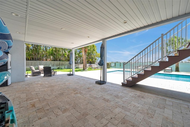 7115 Bay St, St Pete Beach, FL 33706 - fenced backyard featuring stairs and a patio