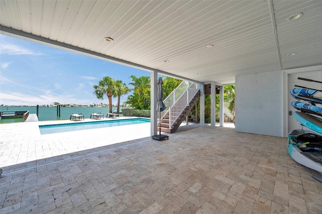 7115 Bay St, St Pete Beach, FL 33706 - view of patio / terrace with stairway and a water view