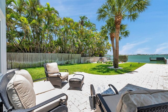 7115 Bay St, St Pete Beach, FL 33706 - view of patio with outdoor lounge area and a water view