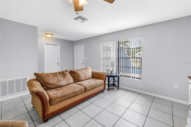 2270 Amherst Ave, Spring Hill, FL 34609 - living room featuring a ceiling fan, baseboards, and light tile patterned floors