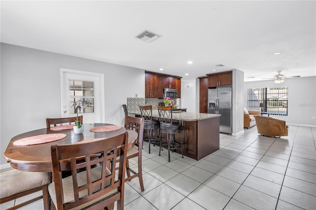 2270 Amherst Ave, Spring Hill, FL 34609 - dining space featuring light tile patterned floors, recessed lighting, ceiling fan, and baseboards